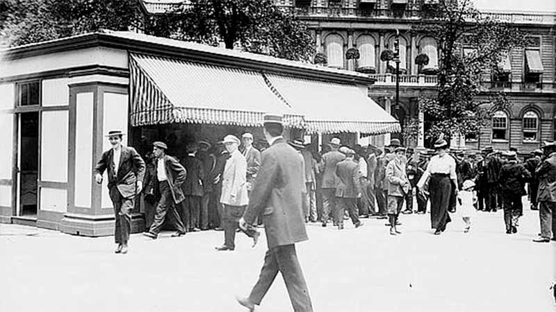 Crowd gathered at Nathan Straus's pasteurized milk depot in City Hall Park, New York City, circa 1900