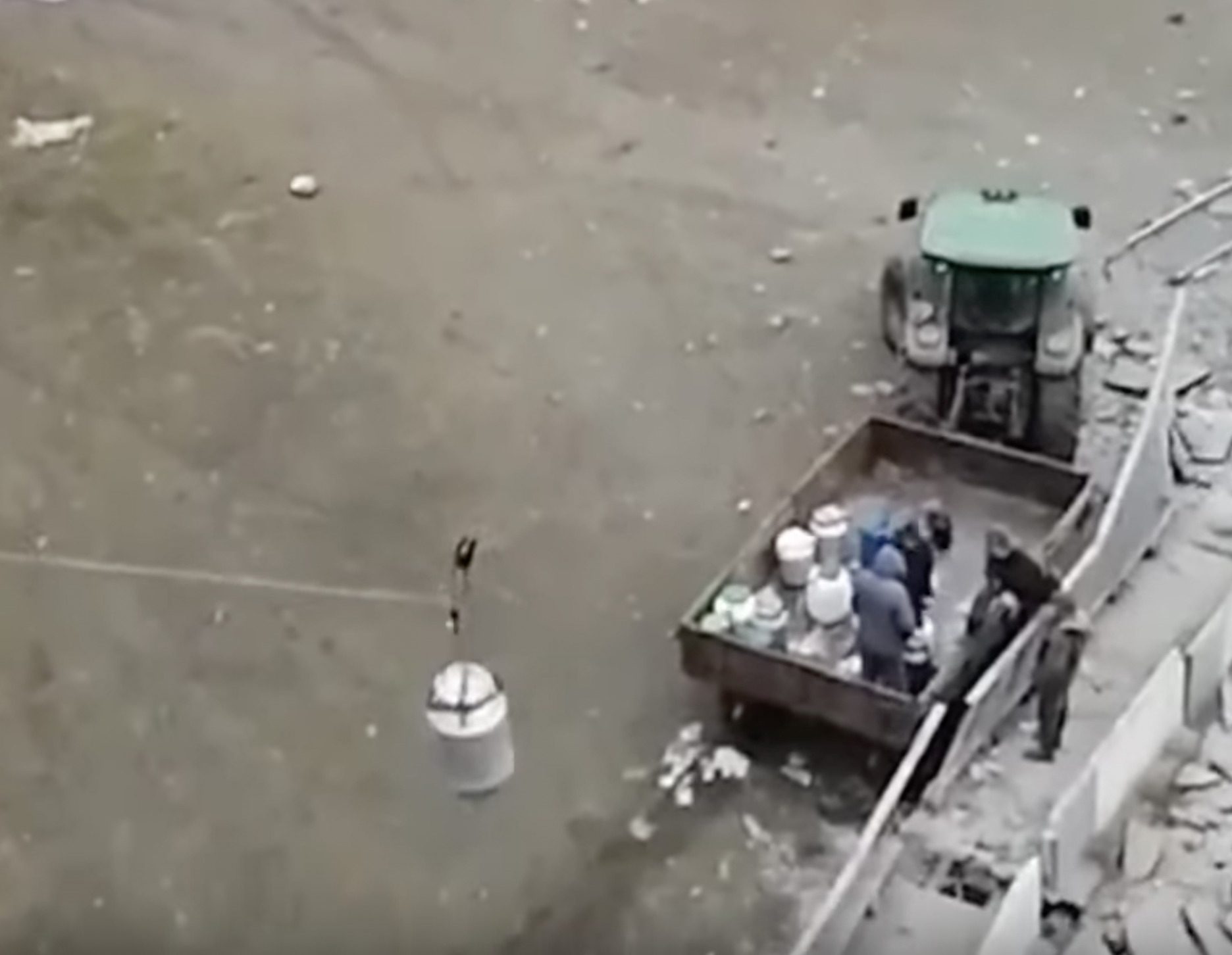 Ukrainian dairy farmers delivering milk over destroyed bridge