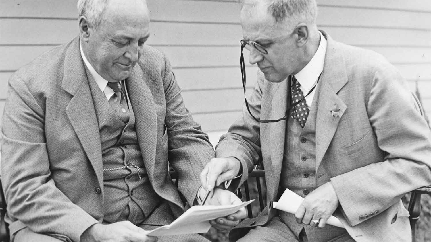 Henry Williams Jeffers and Hubert Everett Van Norman reviewing records at Walker-Gordon certified dairy farm, 1930